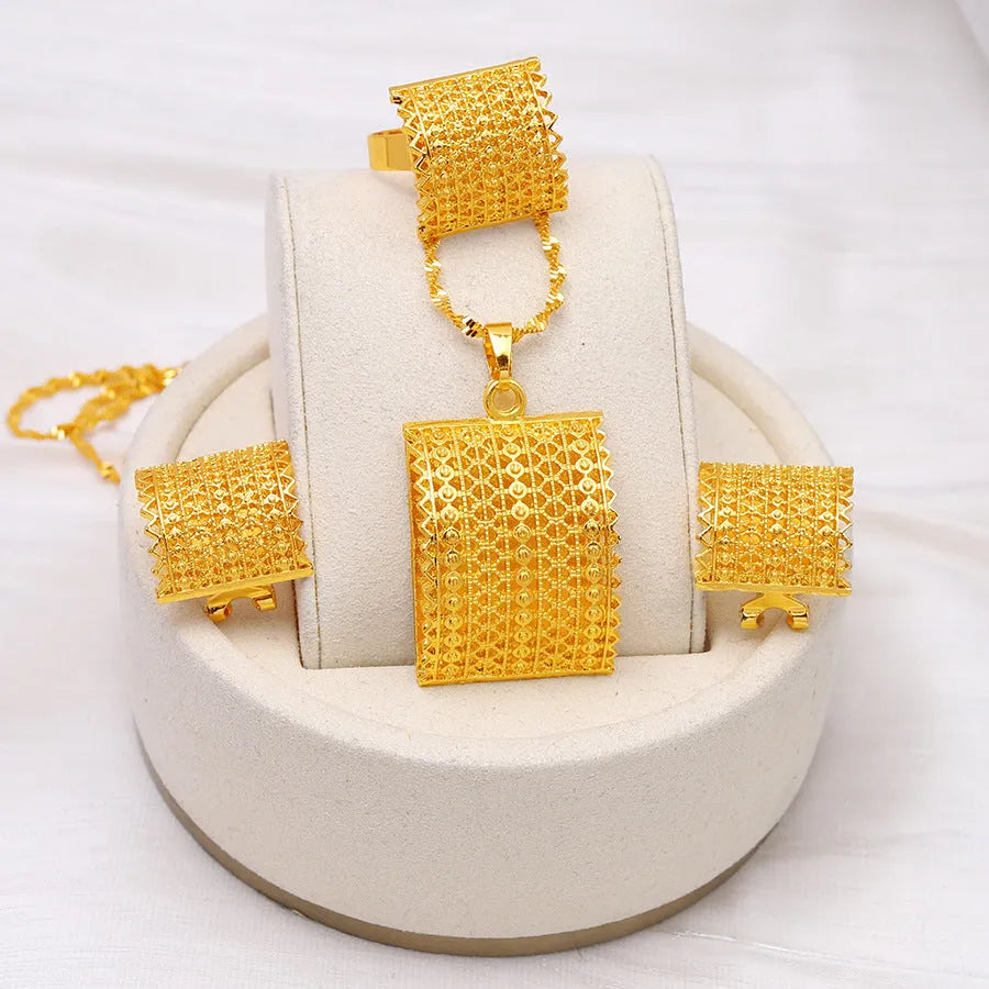 Golden copper bridal jewellery set featuring a necklace, pair of earrings, and a ring.