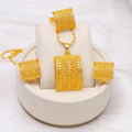 Golden copper bridal jewellery set featuring a necklace, pair of earrings, and a ring.