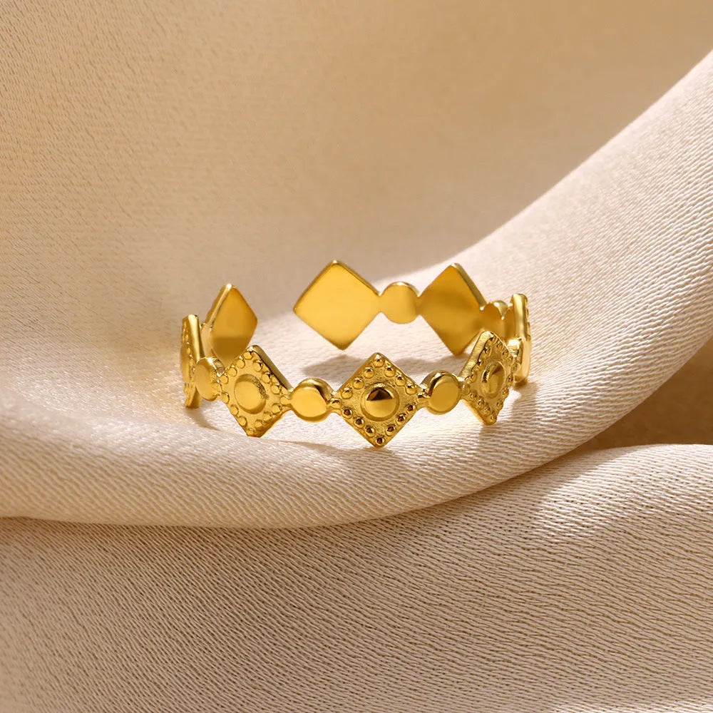 Gold-coloured geometric titanium steel women's ring with diamond detailing