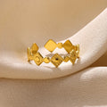 Gold-coloured geometric titanium steel women's ring with diamond detailing