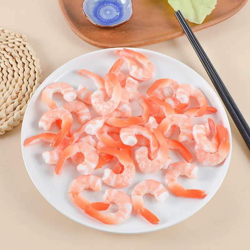White PVC shrimp simulation keychain with metal door buckle, shown from the side to highlight its 1.5cm thickness.
