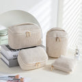 Four cube-style flannelette makeup bags in matching design with colour options including pink dots and khaki
