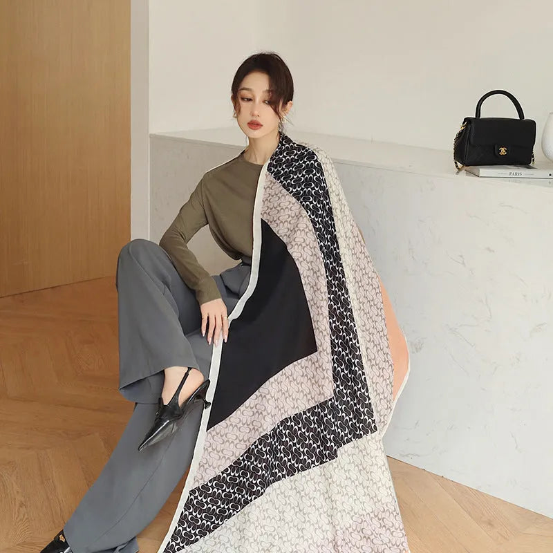Polyester vintage print scarf measuring 180cm by 90cm shown in mid-length shawl style