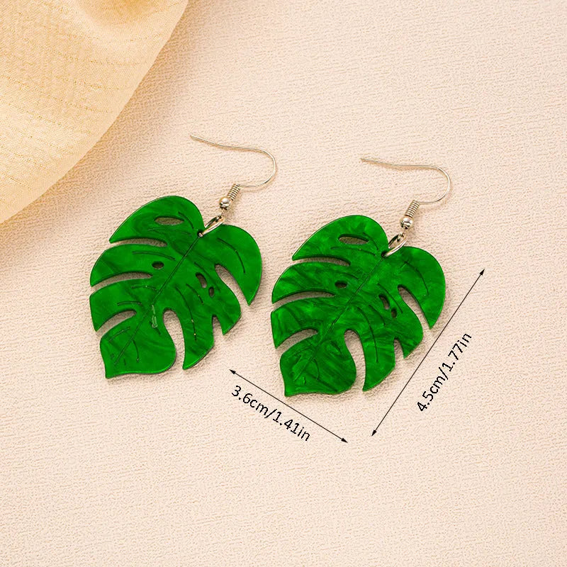 Drop shape earrings with a white acrylic coconut artocarpus charm and silver alloy hook.
