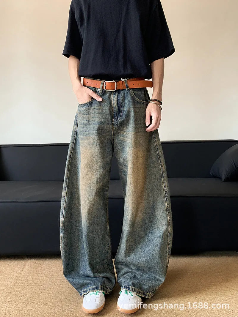 Men's retro blue distressed denim jeans with machete detailing and wide-leg fit