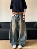 Men's retro blue distressed denim jeans with machete detailing and wide-leg fit