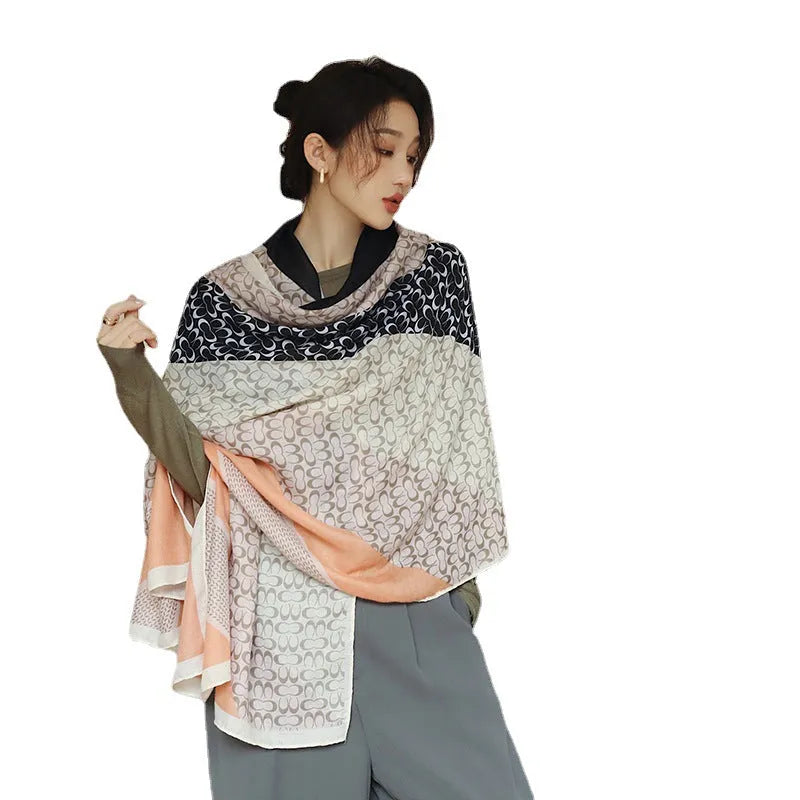 Polyester vintage print scarf measuring 180cm by 90cm shown in mid-length shawl style