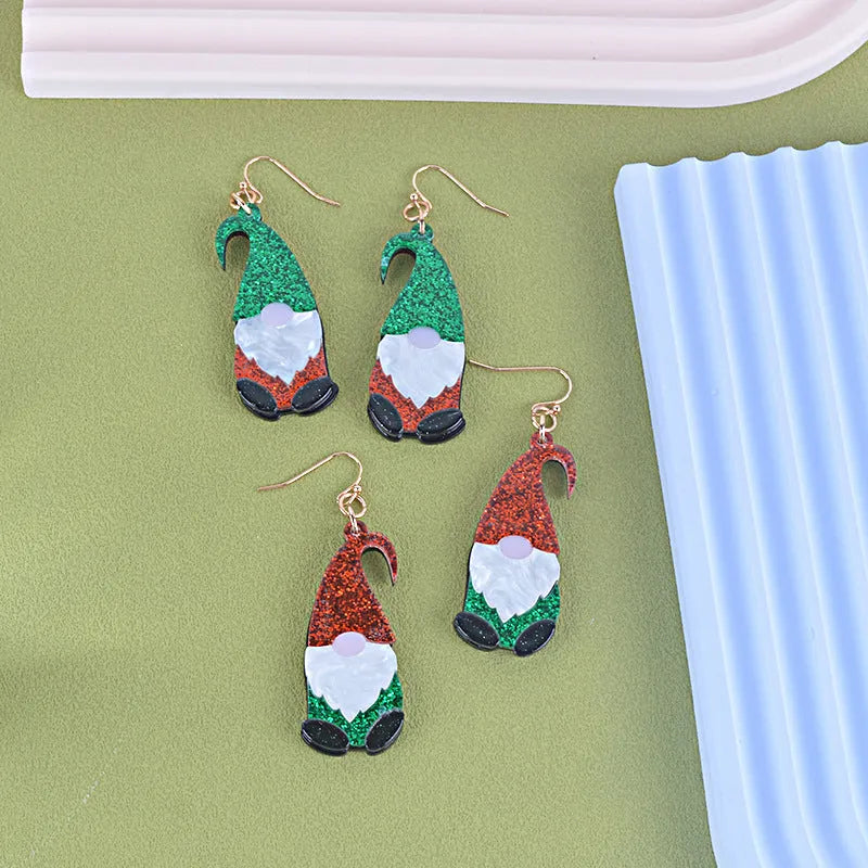 Cartoon Santa Claus character earrings in acrylic with red, green, or mixed hat styles