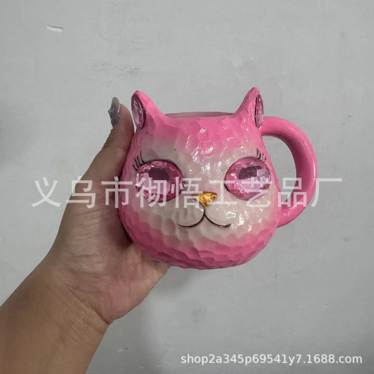 Resin cat cup crystal globe decorative ornament on a desk, shown in purple colour.