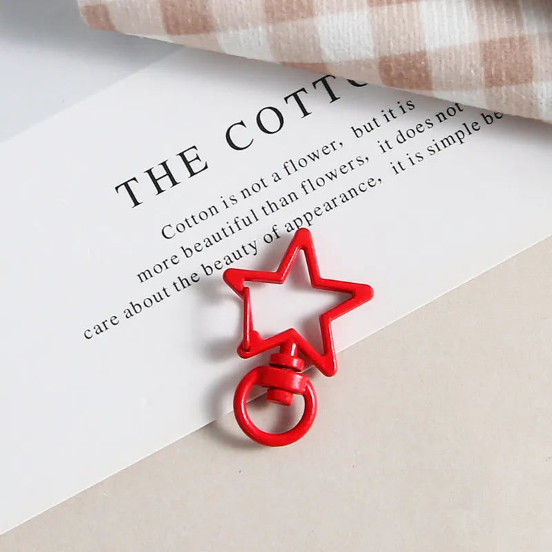 Metal five-pointed star snap button keychain with colour paint finish in alloy, small size, thirteen colour options including beige and sapphire blue