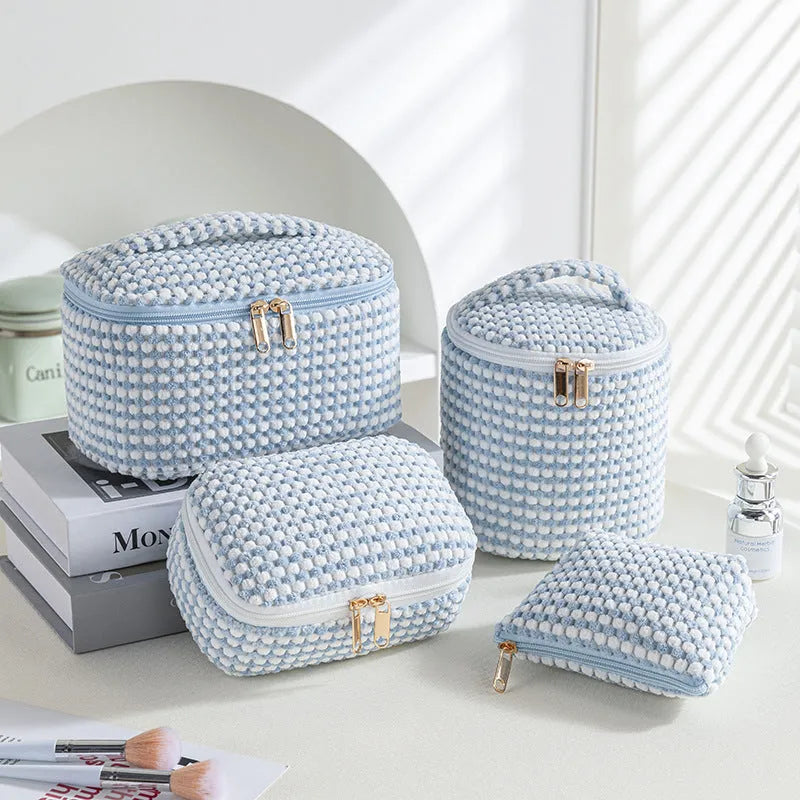 Four cube-style flannelette makeup bags in matching design with colour options including pink dots and khaki