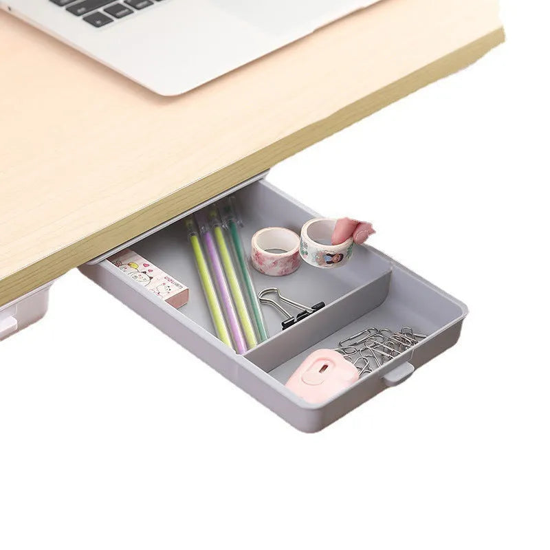 White plastic adhesive under-table storage drawer box with a grid-pattern lid