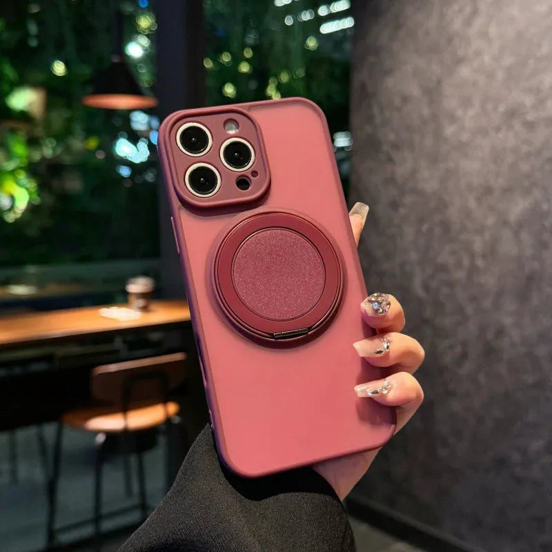 Frosted transparent magnetic phone case with a built-in stand for iPhone, shown in plum colour.