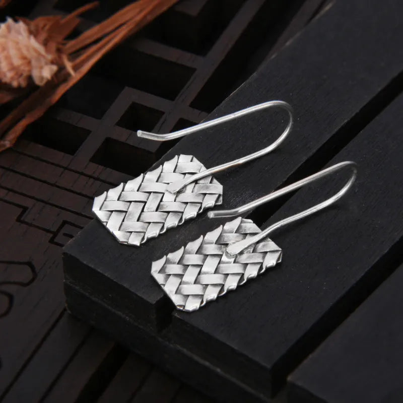 Silver geometric woven plaid earrings measuring 17.5mm by 11mm