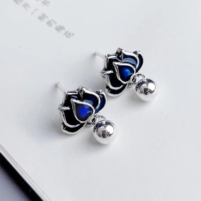 Blue lotus earrings with retro artistic design and lotus seedpod tassel, measuring 1.2cm wide