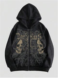 Man wearing a black hooded sweatshirt with a large white skull print on the front.