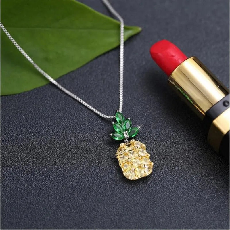 Silver geometric pineapple diamond necklace on white background