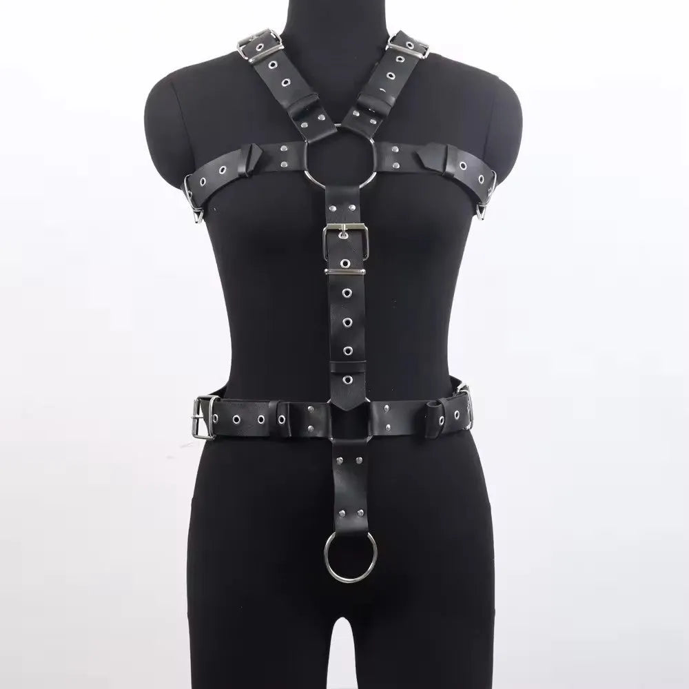 Black patent leather finish shapewear bodysuit with thin straps and a front pin buckle closure.