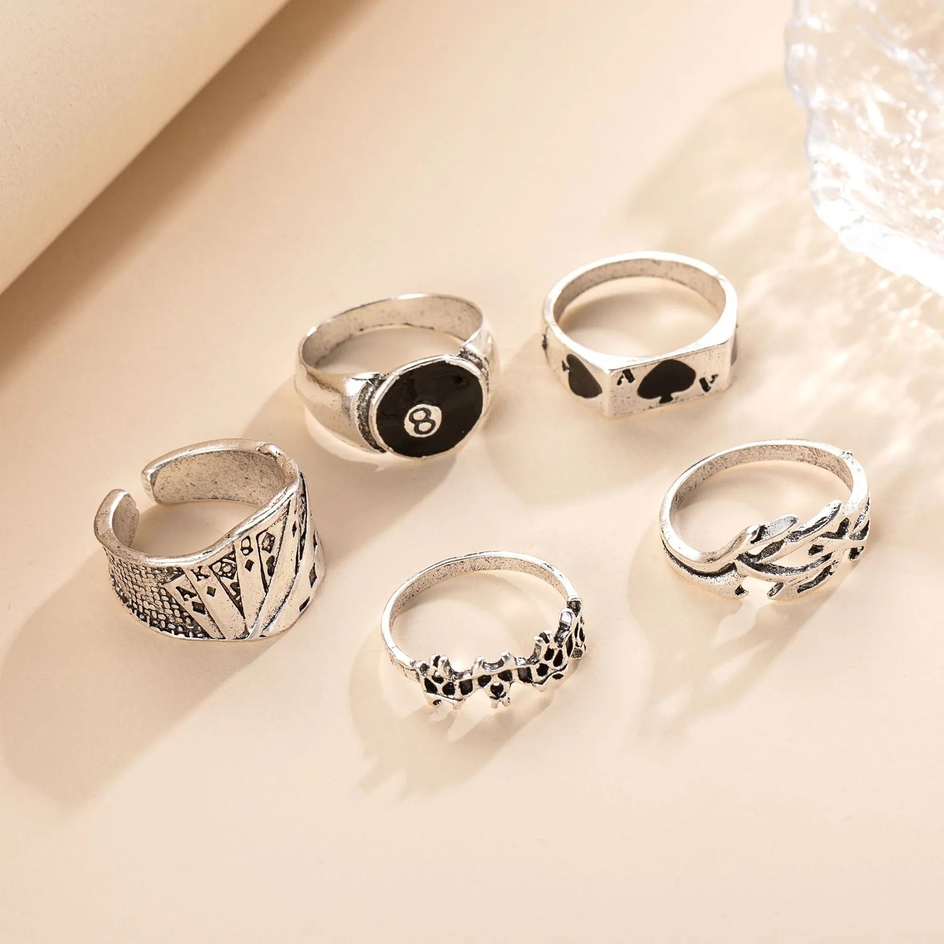 Black alloy ring featuring a detailed retro spade card design on an adjustable band.