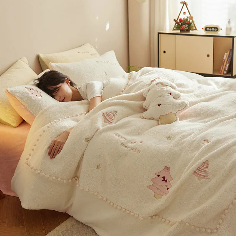 Winter milk fibre princess-style bedding four-piece set with green Christmas tree pattern on a bed.