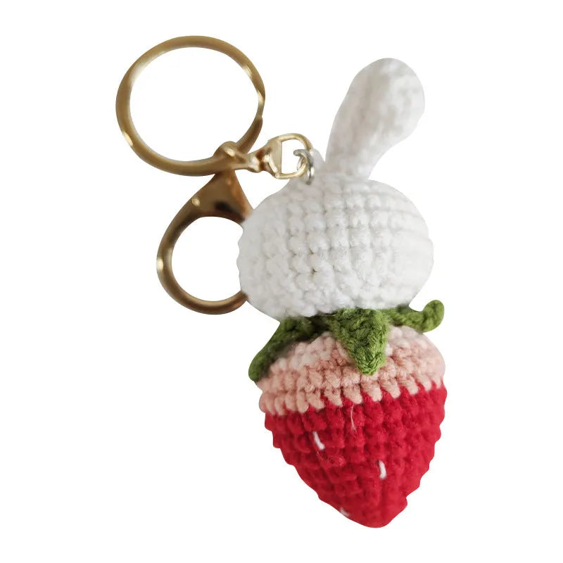 Hand-woven white rabbit strawberry pendant keychain made from four-strand doll wire.