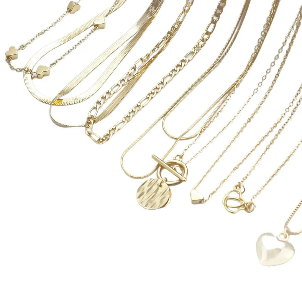 Women's gold necklace set with 10 pendant pieces on adjustable snake bone chain