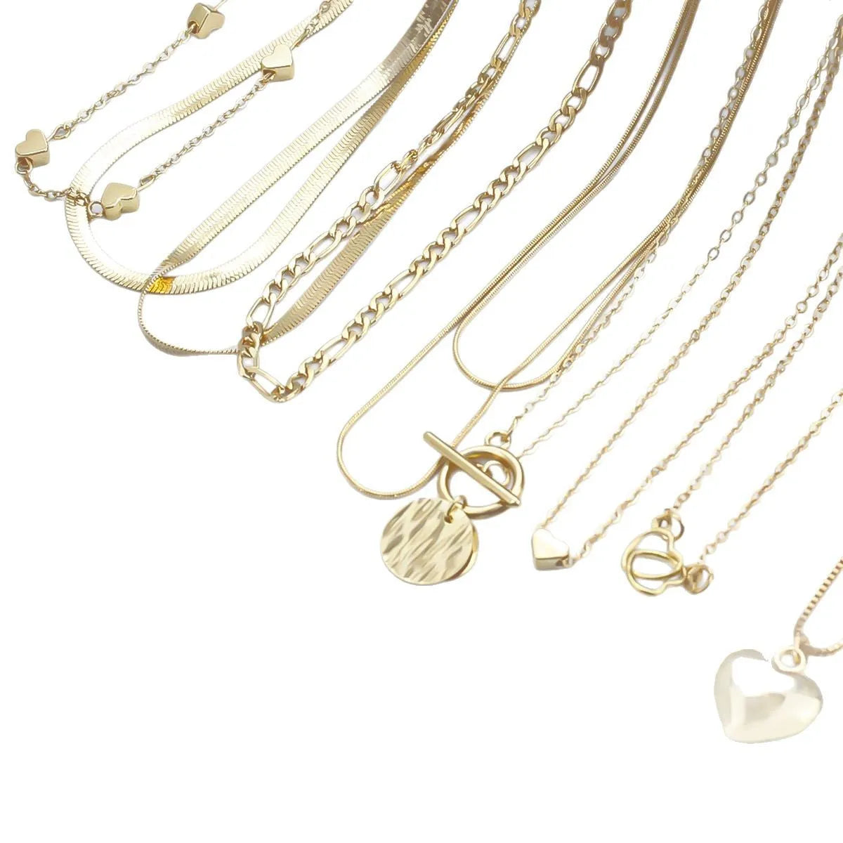 Women's gold necklace set with 10 pendant pieces on adjustable snake bone chain
