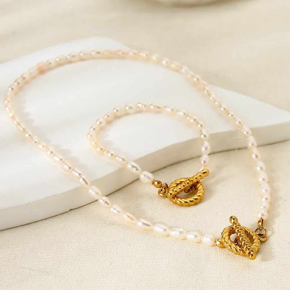 Women's adjustable freshwater pearl necklace and bracelet set with geometric stainless steel pendant