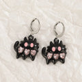 Women's alloy earrings with cross and heart designs in five colour variations including white, black cat, and antique silver