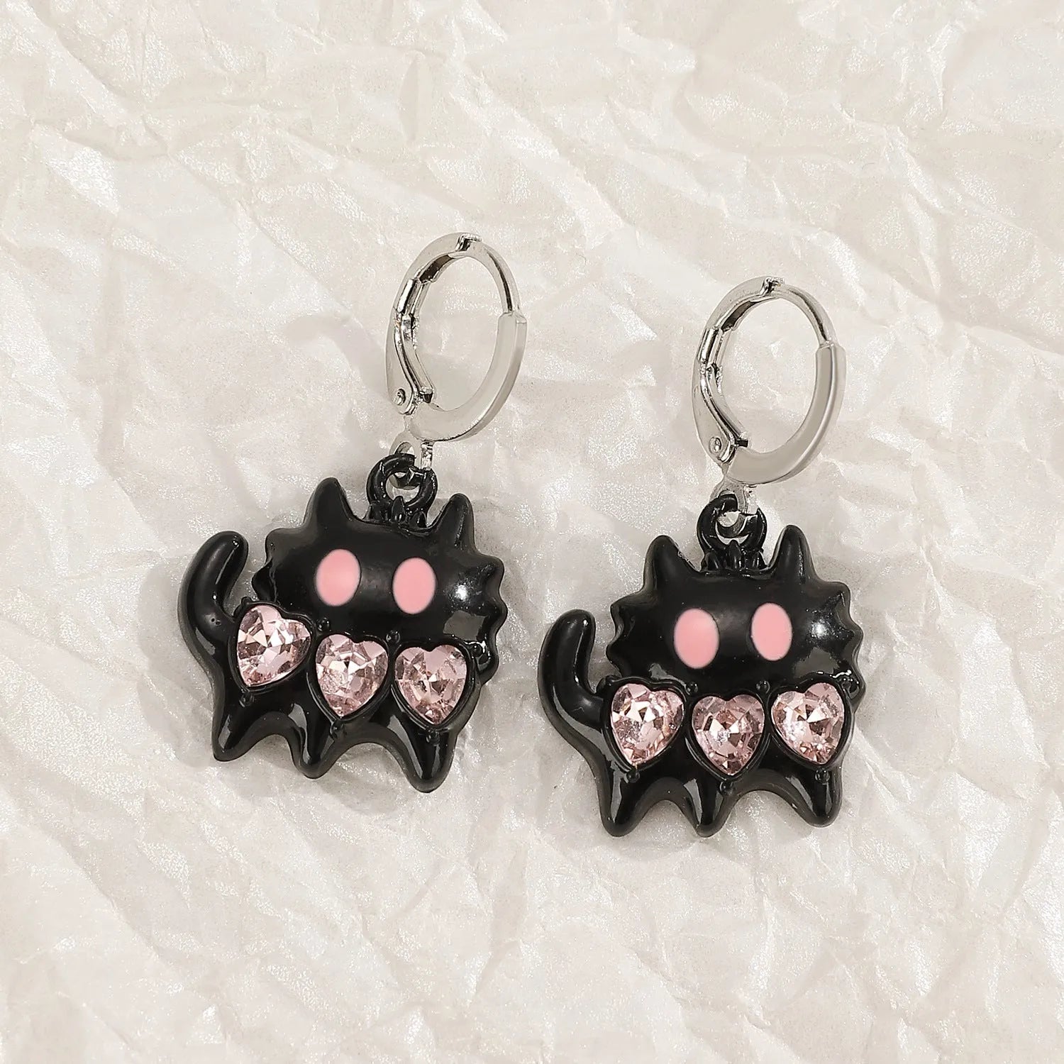 Women's alloy earrings with cross and heart designs in five colour variations including white, black cat, and antique silver