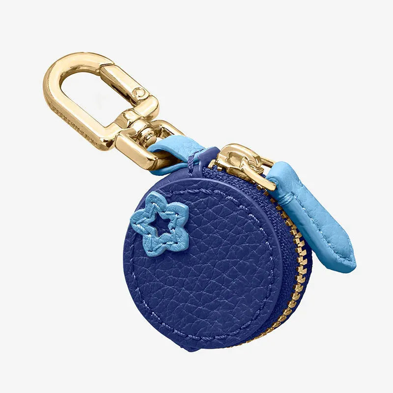 Mini solid colour PU leather coin pouch keychain in cherry red on a keyring.