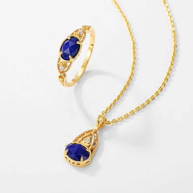 Geometric silver alloy ring with blue lapis lazuli stone centrepiece, elliptical Japanese style design.