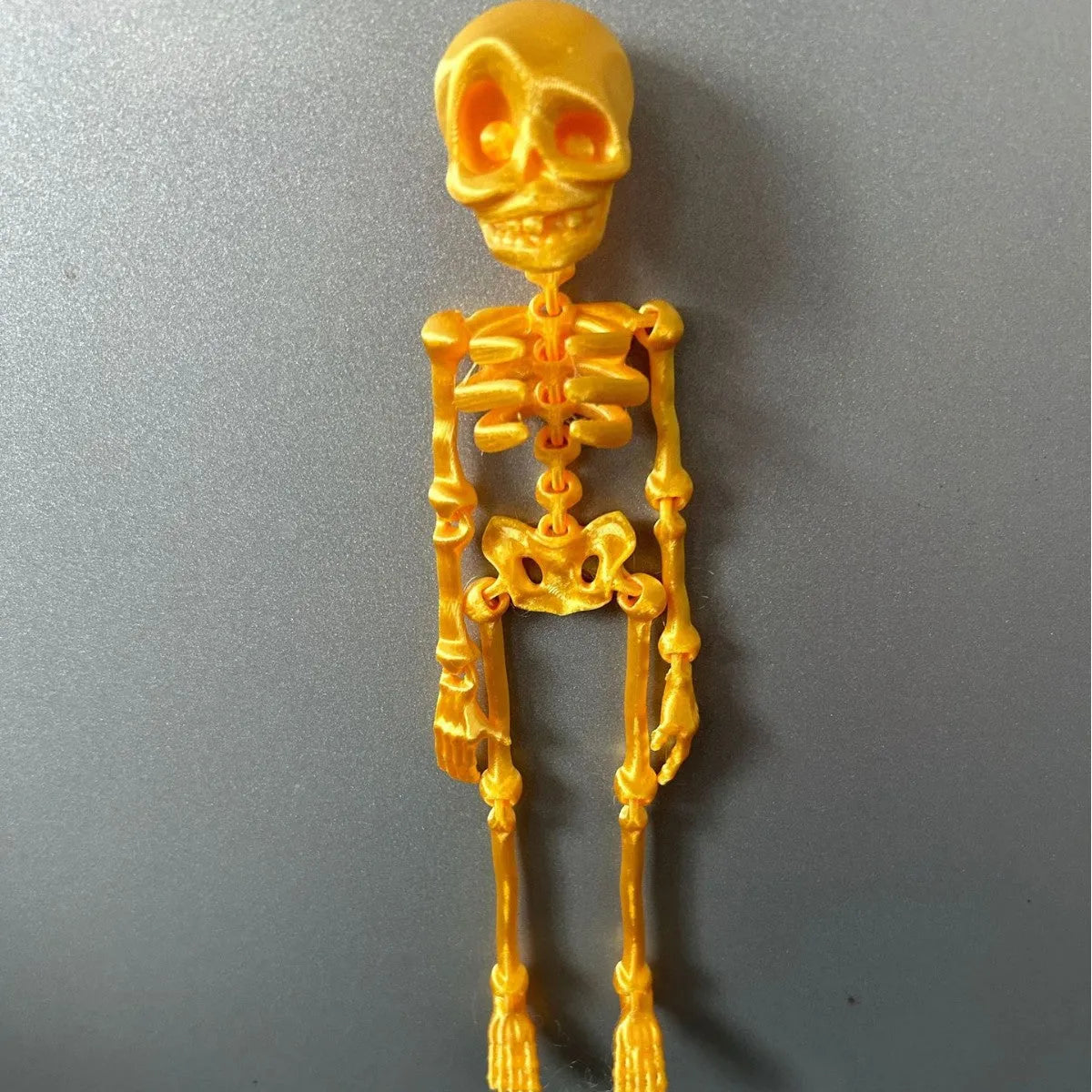 3D printed PLA plastic skull refrigerator magnet in modern art style, 18cm tall.