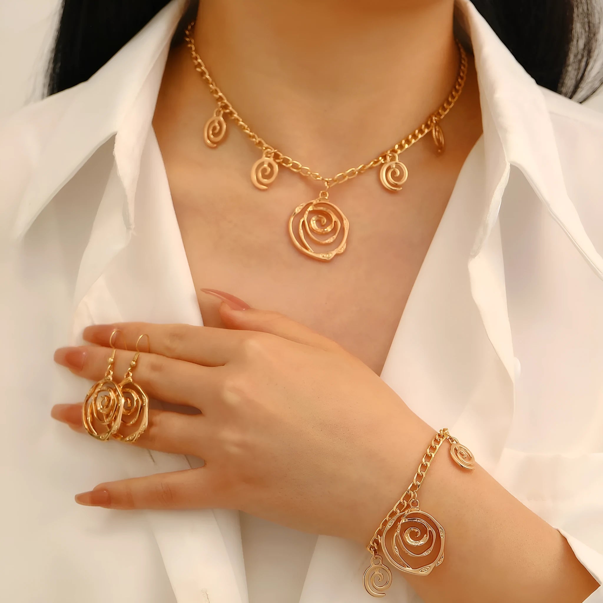 Spiral donut design jewellery set with necklace, bracelet and earrings in gold electroplated alloy