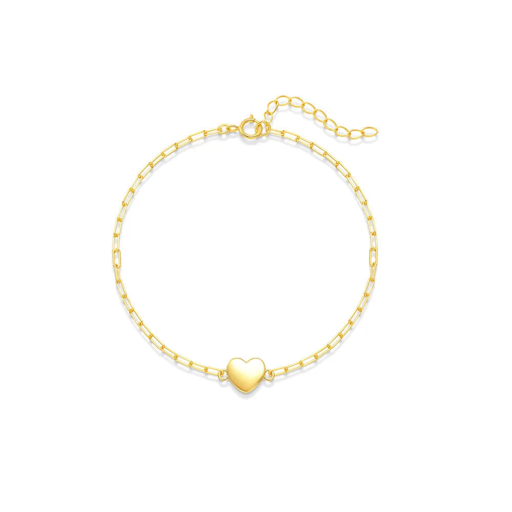 Gold plated S925 sterling silver bracelet with heart charm and geometric clip chain on wrist