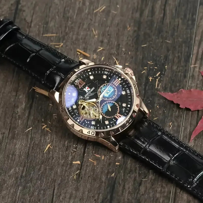 Men's black skeleton automatic watch with rose gold case and brown leather strap.