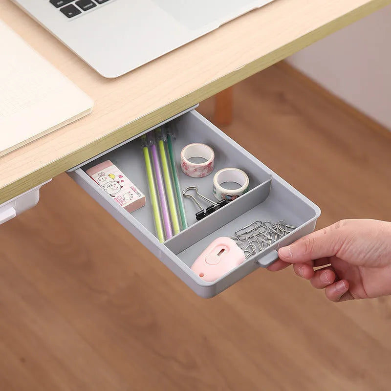White plastic adhesive under-table storage drawer box with a grid-pattern lid