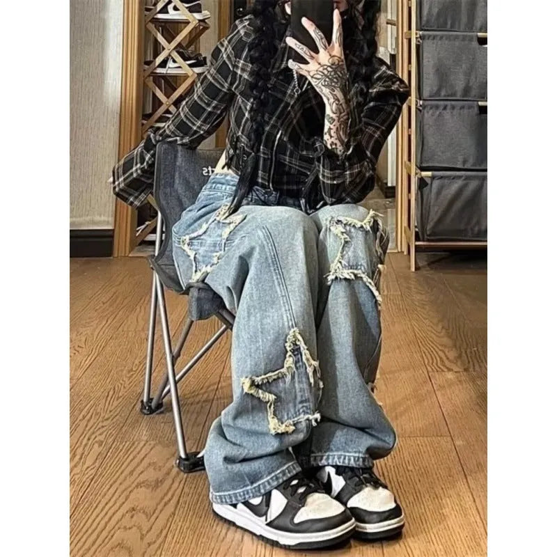Blue women's high-waisted straight-leg denim jeans on a neutral background.