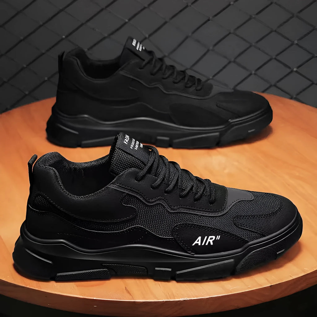 Men's black mesh fabric low top board shoes with front lace-up and plastic sole, side view