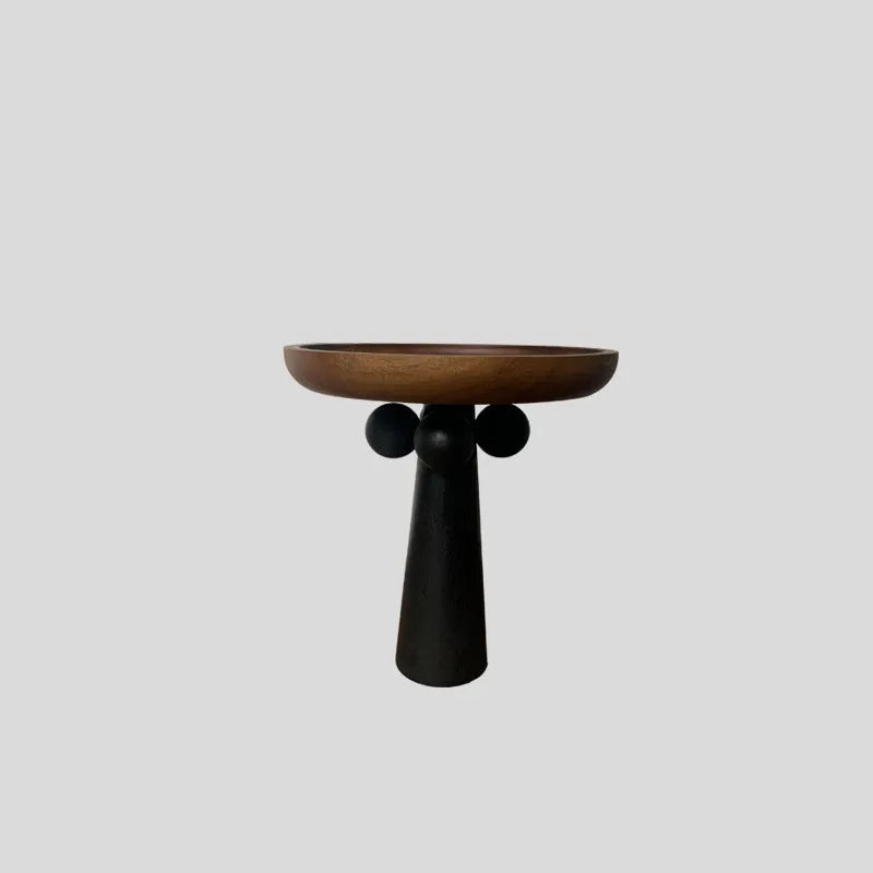 High-legged round wooden tray in a modern Nordic style for candle and decor display.