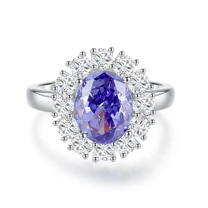 Heart-shaped sterling silver ring with a faceted colour zircon stone on a white background.