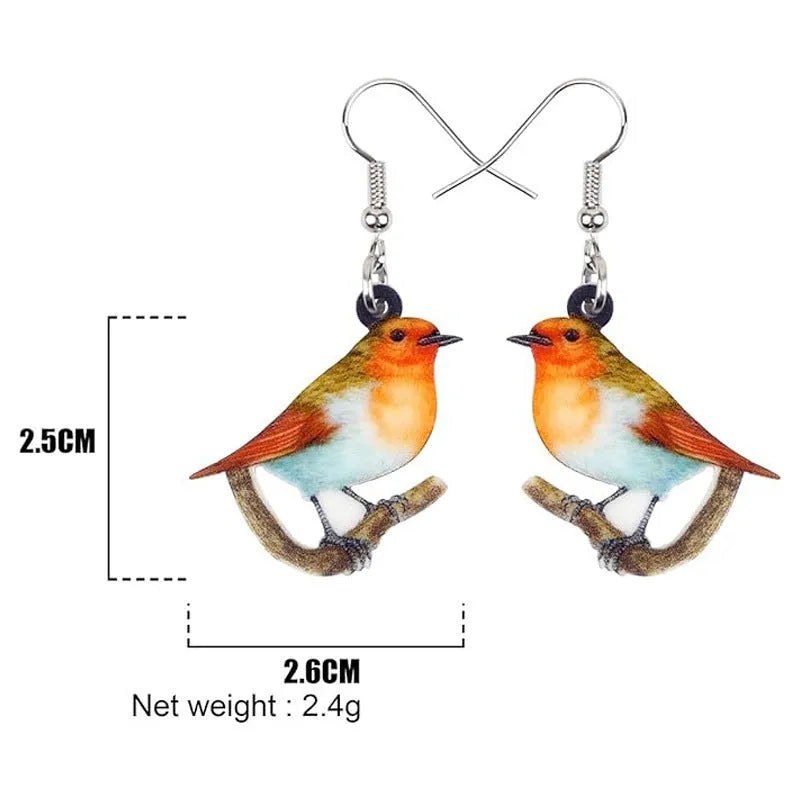 Acrylic clip-on earrings with a blue titmouse bird and geometric snake design.