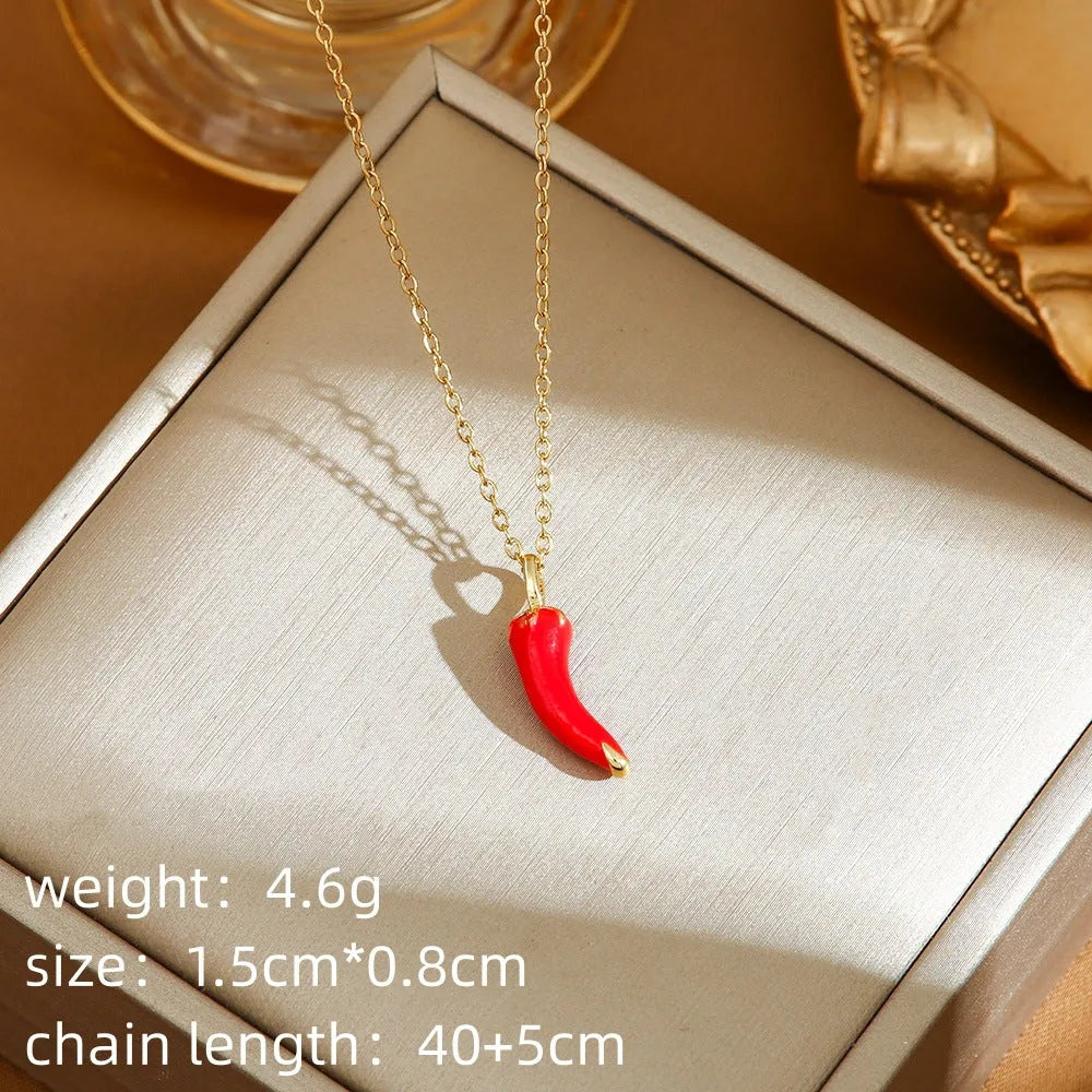 Golden indie necklace with detailed cherry, strawberry, and pepper pendant on a titanium steel O-ring chain.