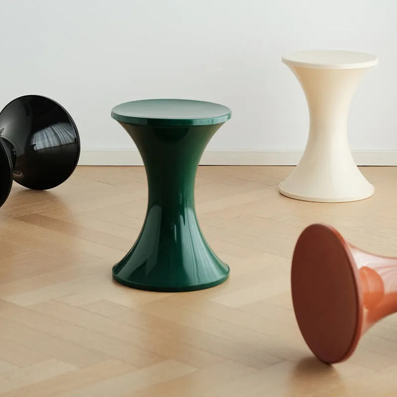 Plastic hourglass shoe changing stool in multiple colours with compact dimensions