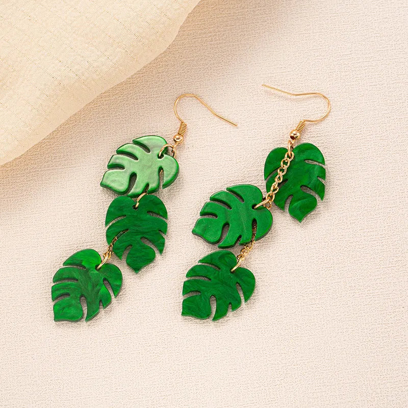 Drop shape earrings with a white acrylic coconut artocarpus charm and silver alloy hook.