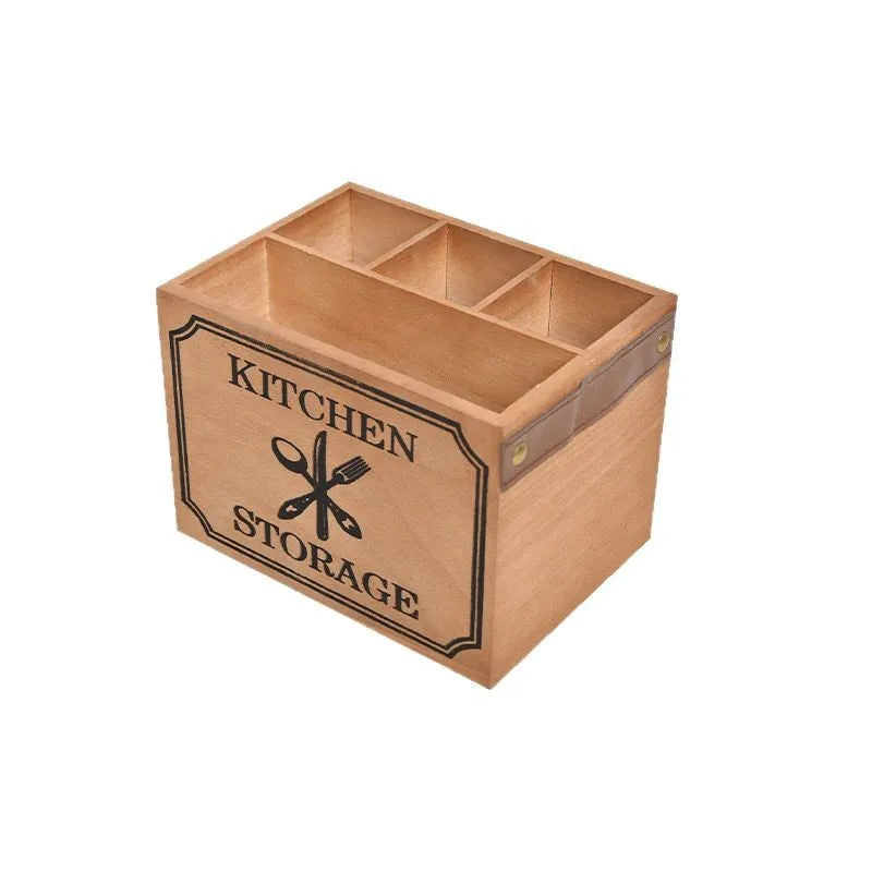Open wooden kitchen storage box with grid divider for knives, forks, and chopsticks.