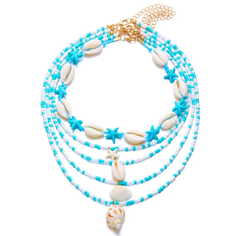 Five women's fashion necklaces with starfish and shell bead designs in blue and multicolour options