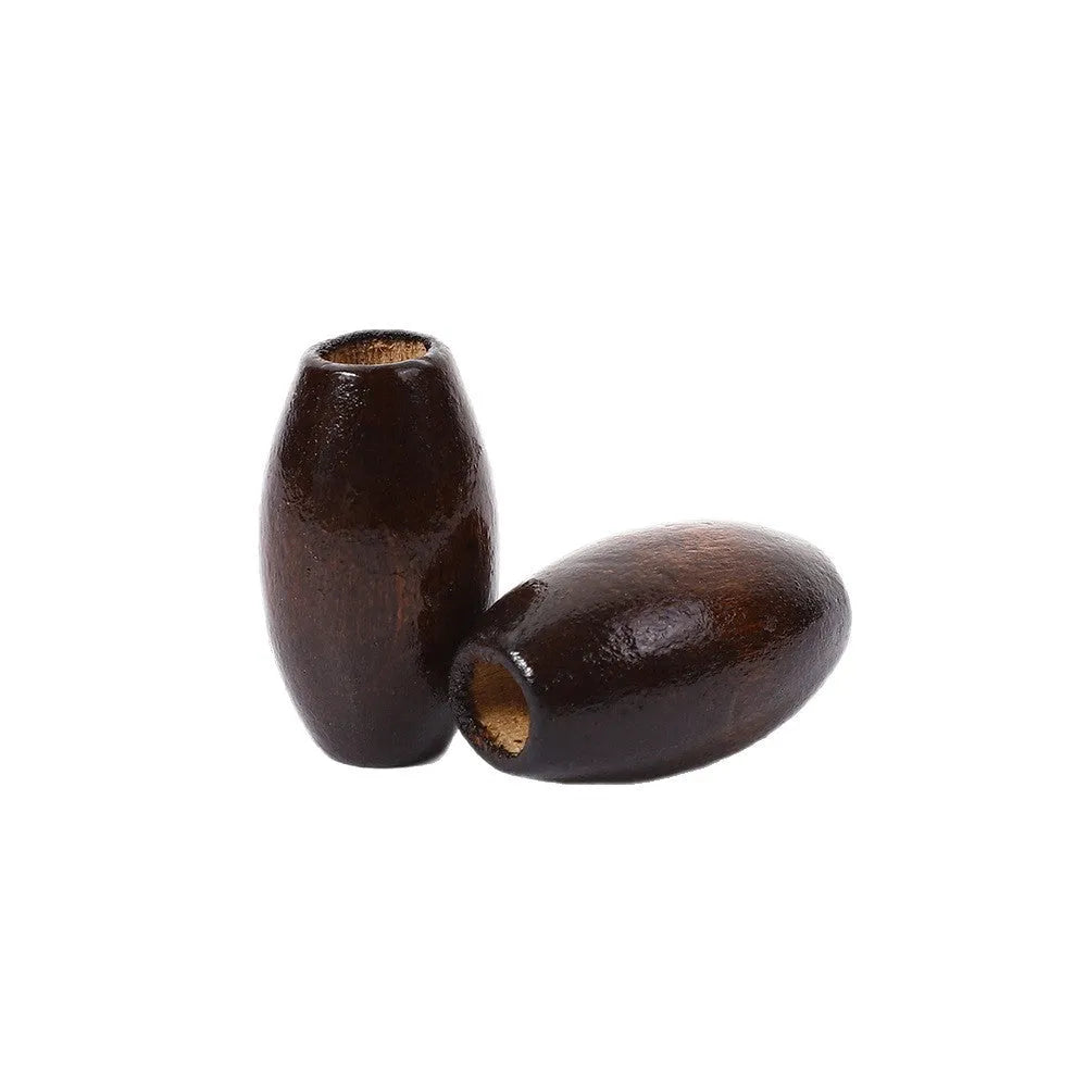 Dark coffee coloured oval M-shaped wooden bead measuring 25mm with a 6mm hole