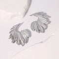 Stainless steel leaf stud earrings with electroplated gold or steel finish