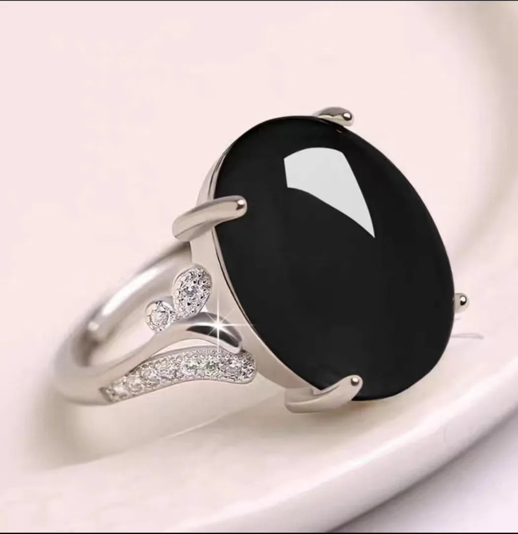 Adjustable ethnic geometric alloy ring showing five colour variations: black, blue, green, red, yellow